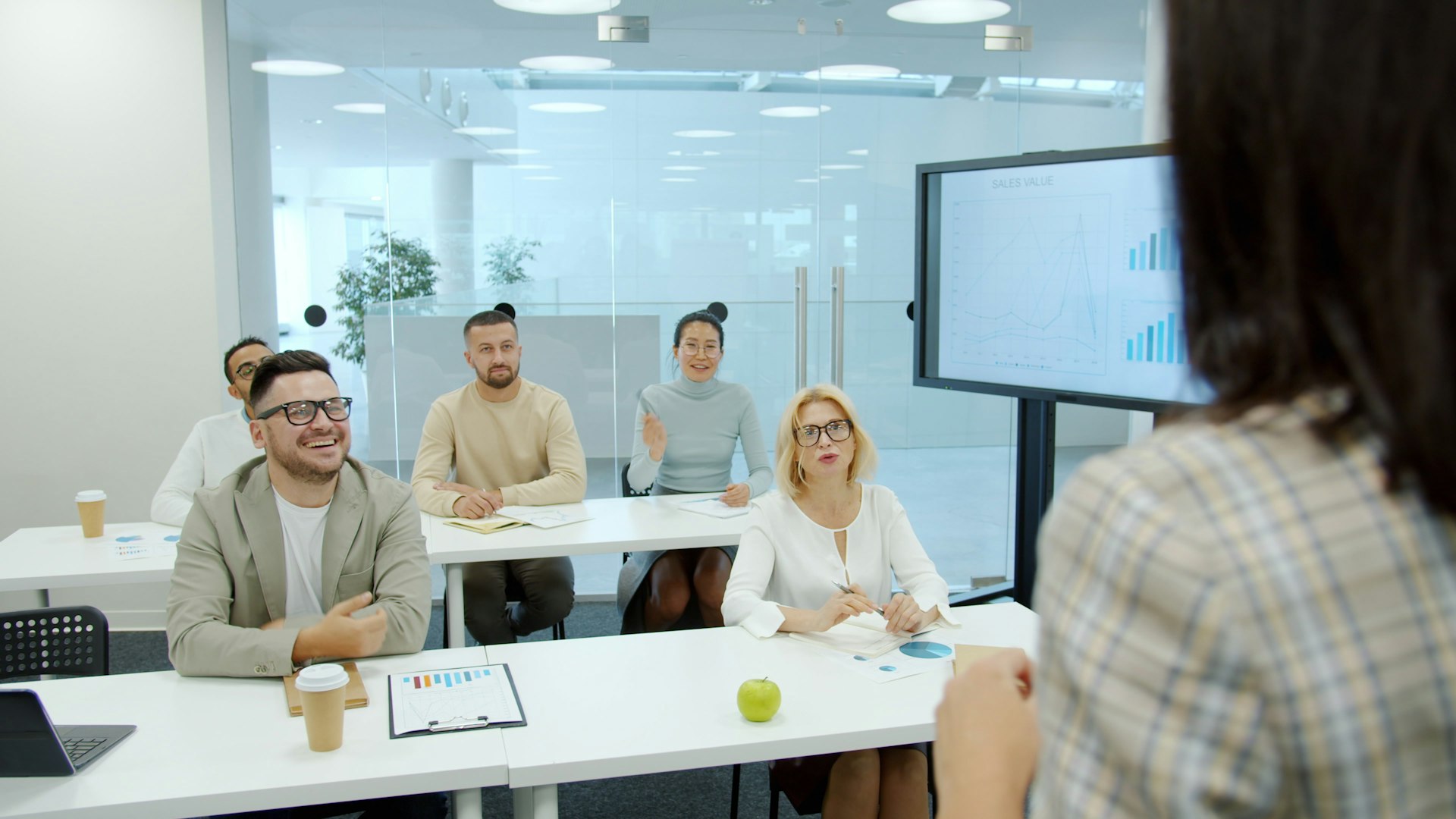 People listen attentively during a business presentation.